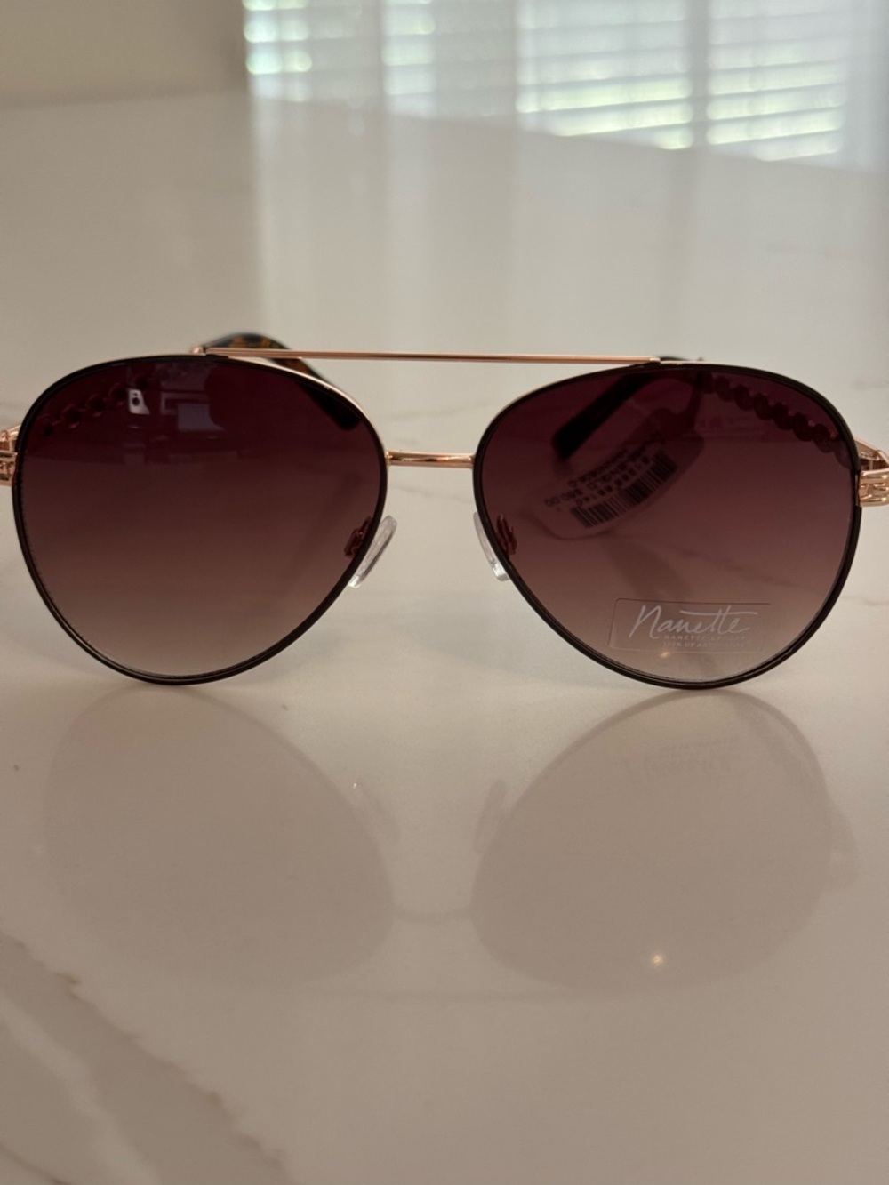 Brand new Nanette Lepore sunglasses with original tags attached.